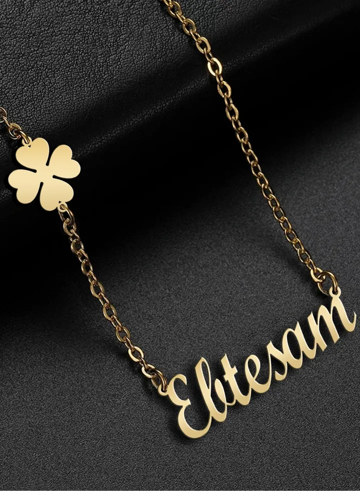 A chain with a pendant with the name Ibtisam and a clover flower, 925 silver, plated with gold