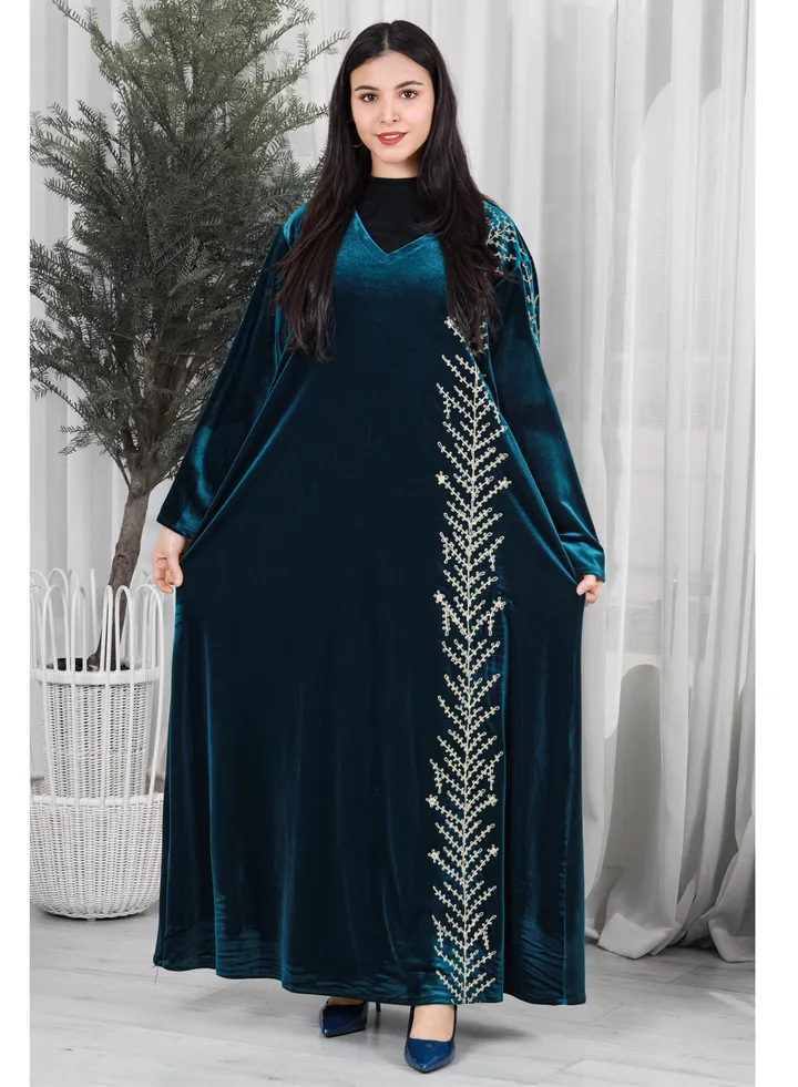 Blue velvet galabiya decorated with gold embroidery