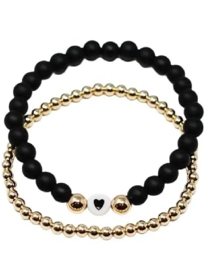 Bracelets made of beads with a black and gold heart design