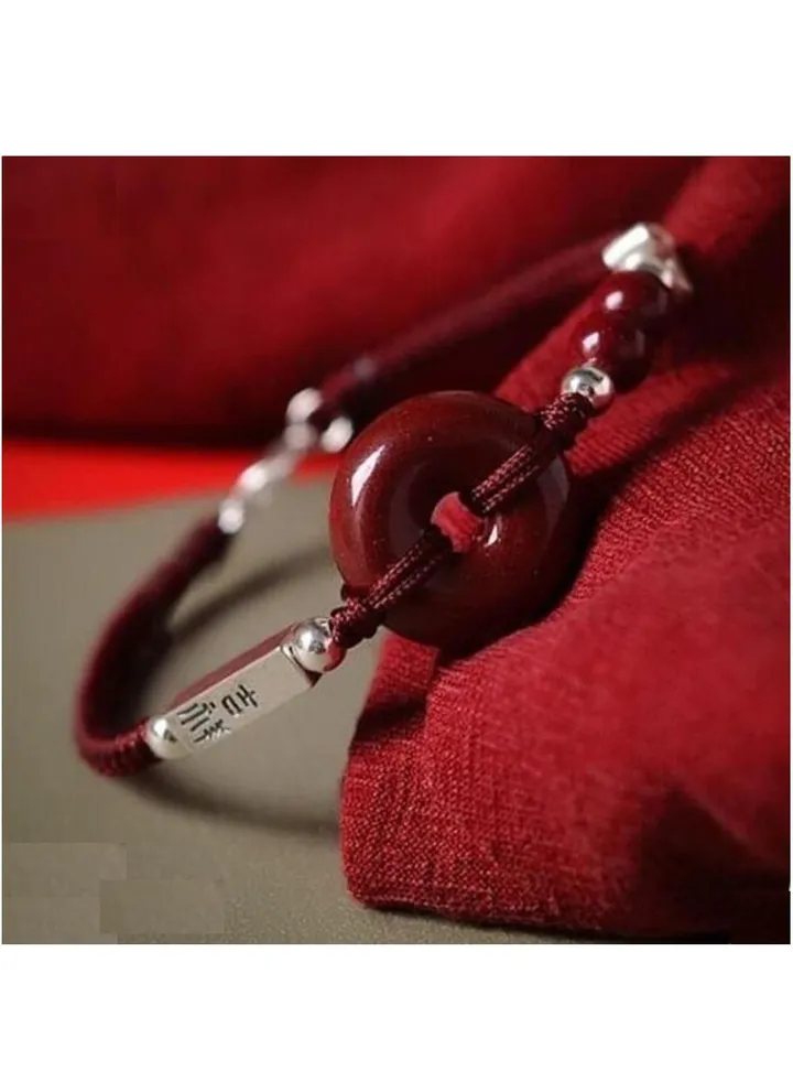 Women's bracelet made of natural cinnabar stone and handmade rope