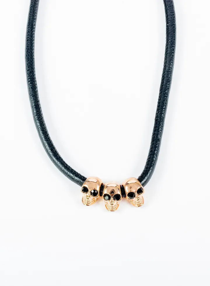 Platinum/leather Necklace with skulls pendant