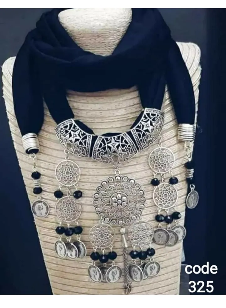 A scarf necklace made of cotton, Lycra, with multiple pendants made of nickel silver and copper wire