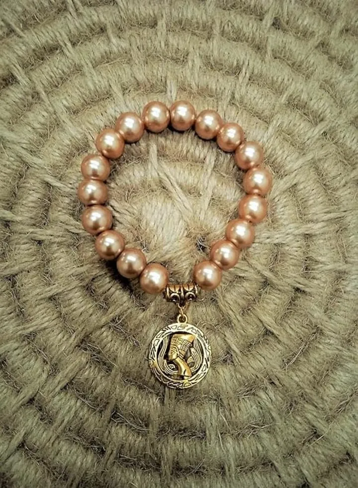 Handmade gemstone bracelet with golden Nefertiti pendant