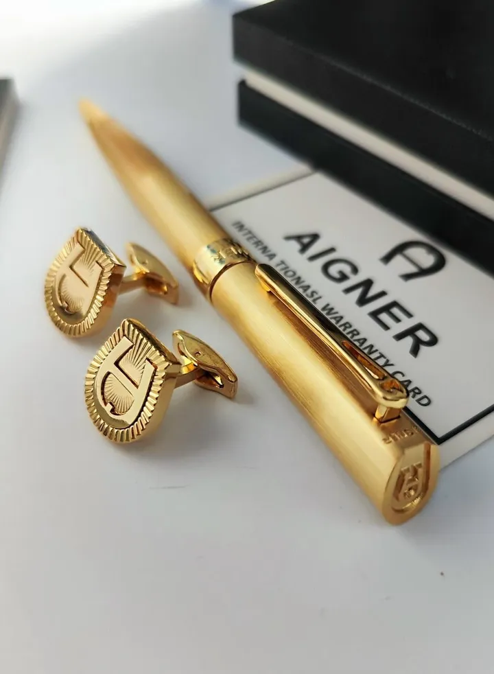 A set of Aigner pen and cuff