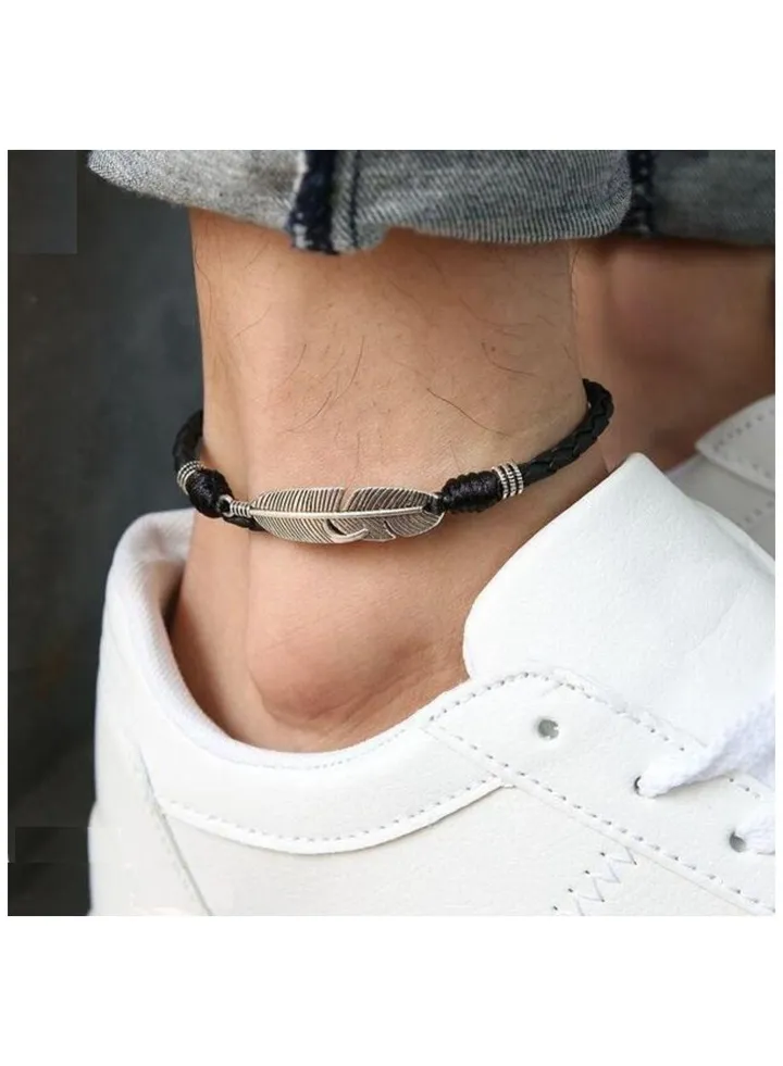 Anklet of natural black leather decorated with a piece of silver steel
