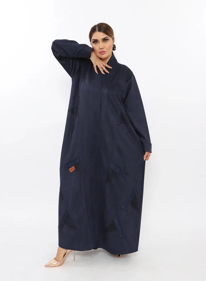 Black winter abaya made of velvet fabric with a floral suede attached
