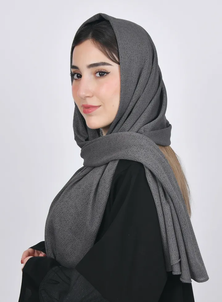A greenish-gray gauze veil