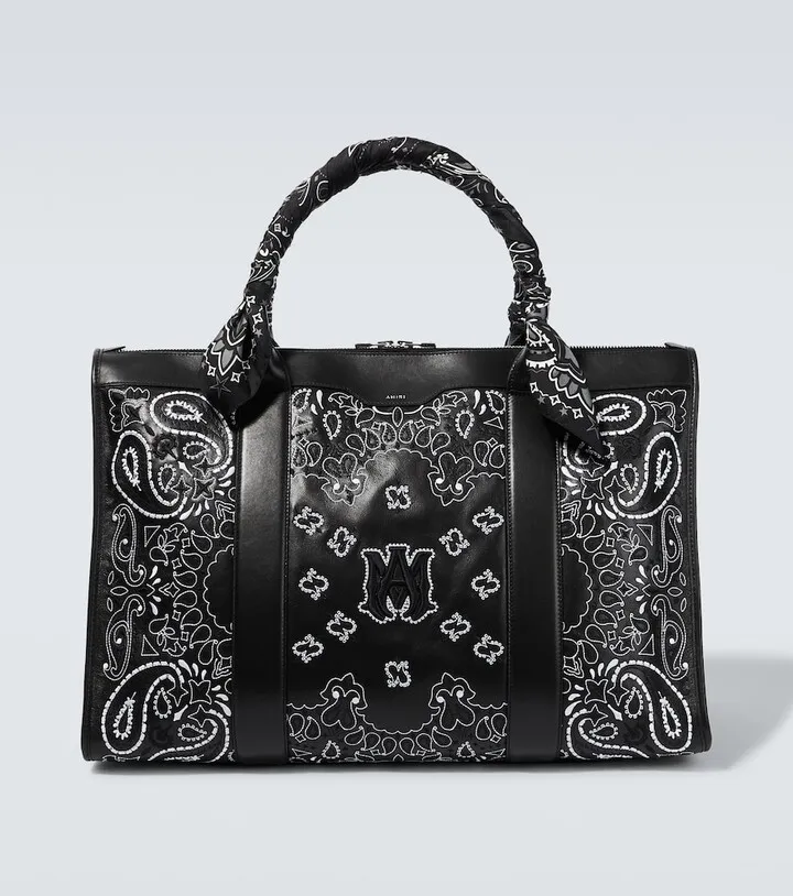 Banana-embroidered leather travel bag