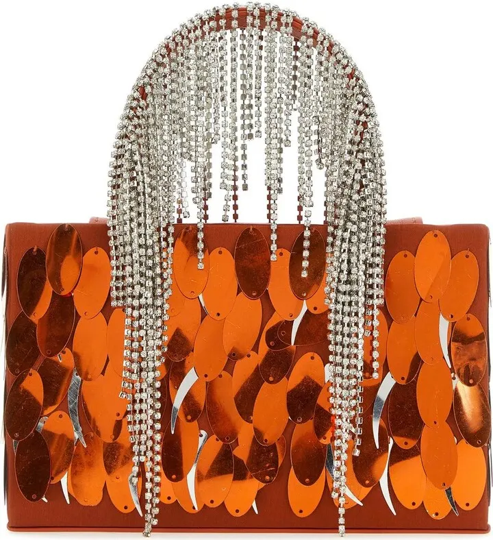 Handbag realized in fabric entirely covered by maxi sequins characterized by two jewel handles.