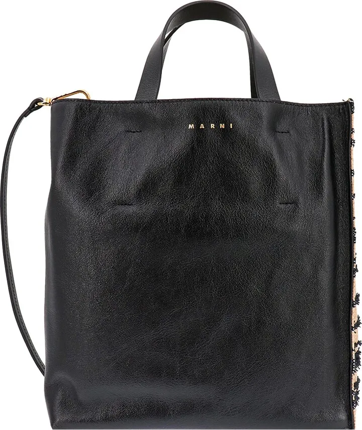 Handbag in leather and canvas with striped pattern