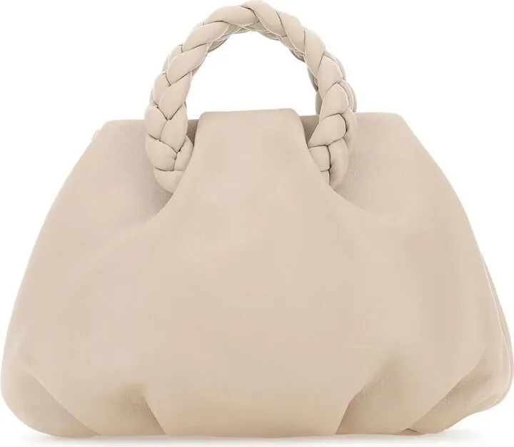 Handbag realized in nappa leather characterized by tonal leather shoulder strap.