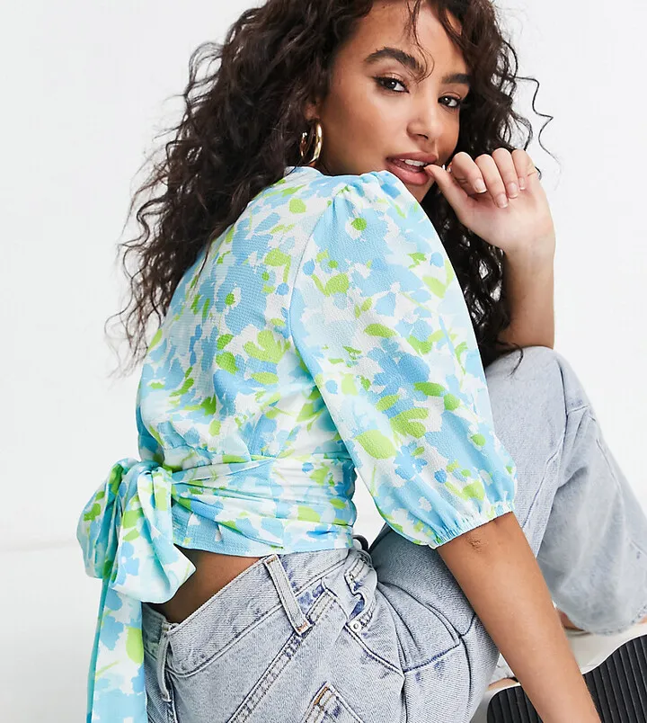 ASOS DESIGN Petite button front tea blouse with volume sleeve and tie back detail in blue & white floral