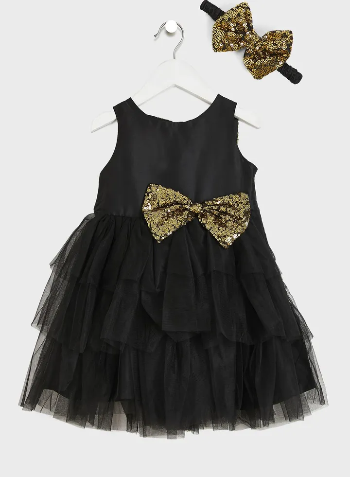 Party Wear Layered Dress With Bow Detailing On Waist
