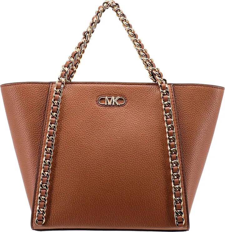 Leather handbag with metal logo on the front