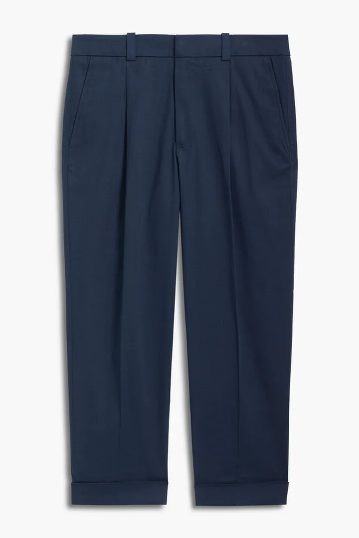 Tapered pleated cotton-blend piqué pants