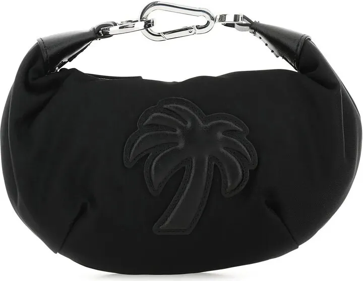 Handbag realized in fabric enriched by tonal leather Palm patch at the front.