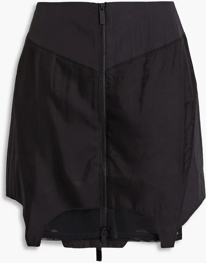 Mesh-paneled shell mini skirt