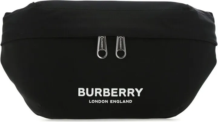 Belt bag realized in nylon with tonal leather inserts enriched by contrasting logoed patch at the front.