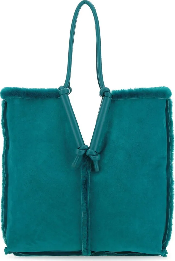 Reversible Shoulder Bag Realized In Shearling Characterized By Peculiar Tonal Leather Round Handles.