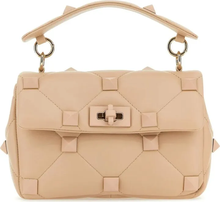Powder rose Light Pink Nappa Leather Medium Roman Stud Handbag from Valentino Garavani Handbag realized in quilted lamb nappa leather enriched by maxi metal studs on the entire surface.