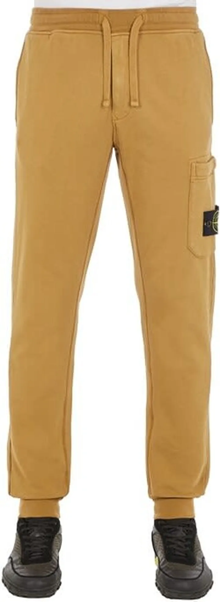 Brown sweatpants with side pocket and logo from Stone Island.