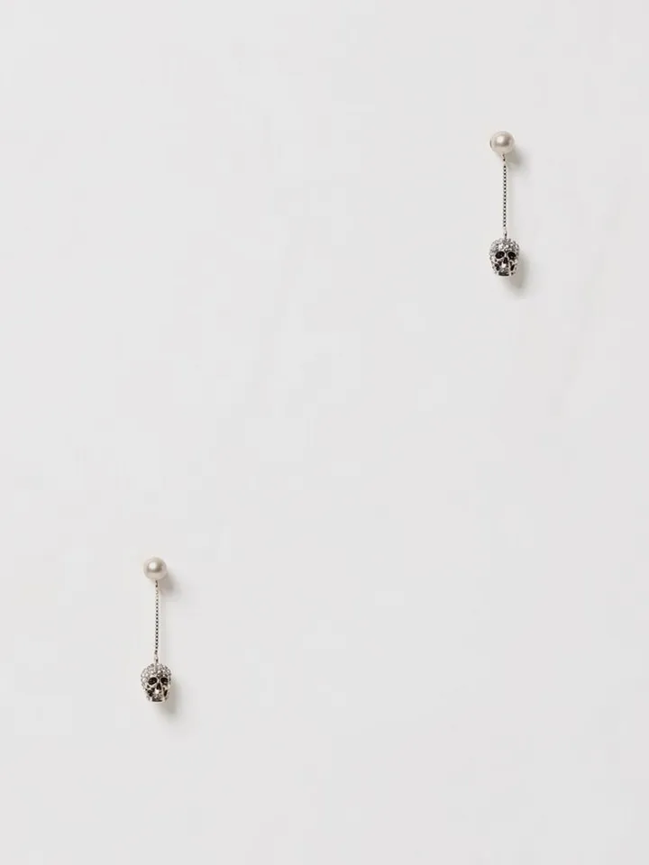 Skull Alexander McQueen earrings in brass