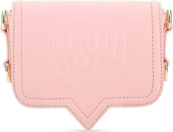Crossbody bag that can be worn as a belt bag realized in synthetic leather characterized by logo in relief at the front enriched by contrasting rubberized logoed patch at the back.