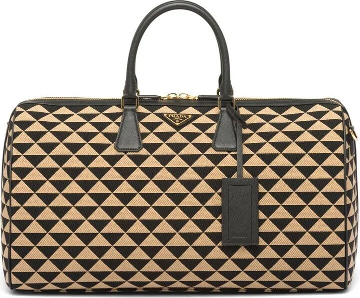 Symbole embroidered fabric travel bag