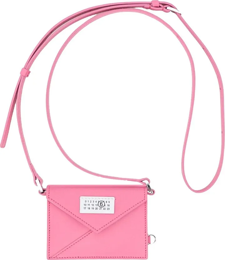 Leather shoulder bag with logo patch on the front