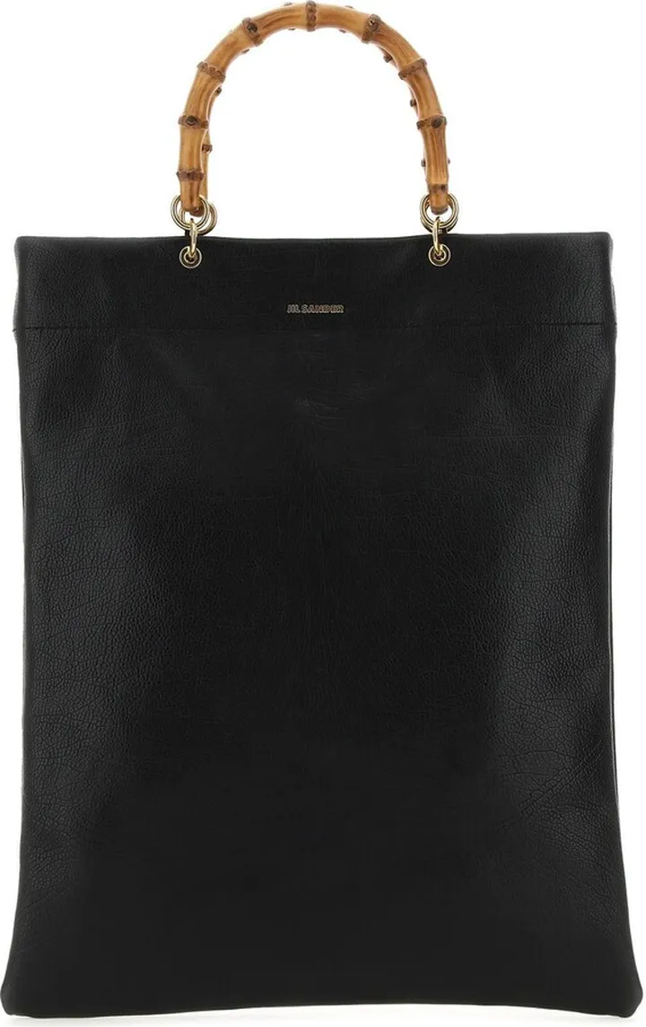 Shopping bag realized in pebble leather characterized by contrasting printed logo at the front.