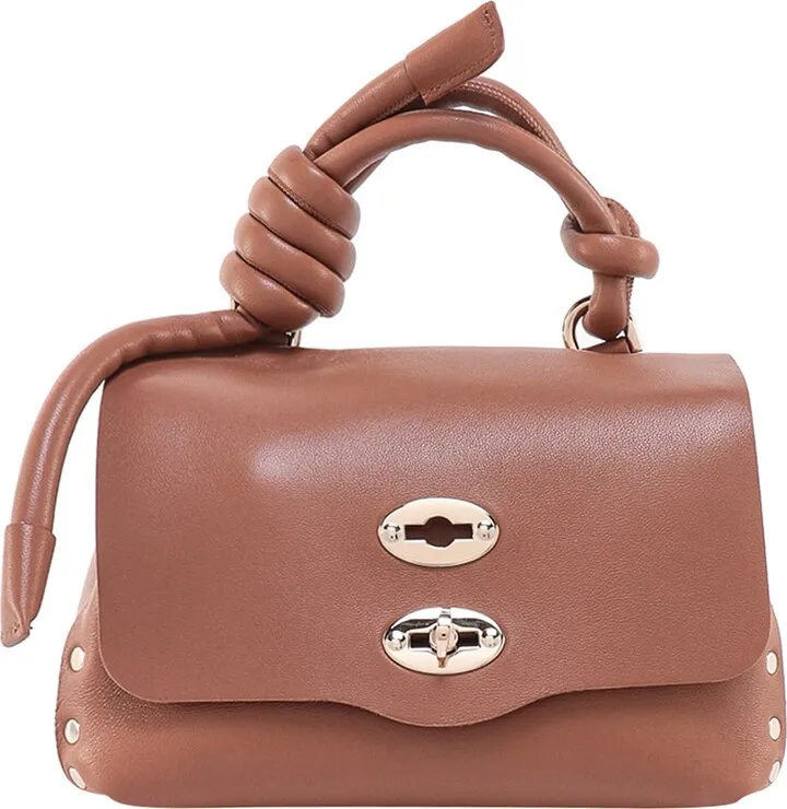 Leather handbag with metal studs