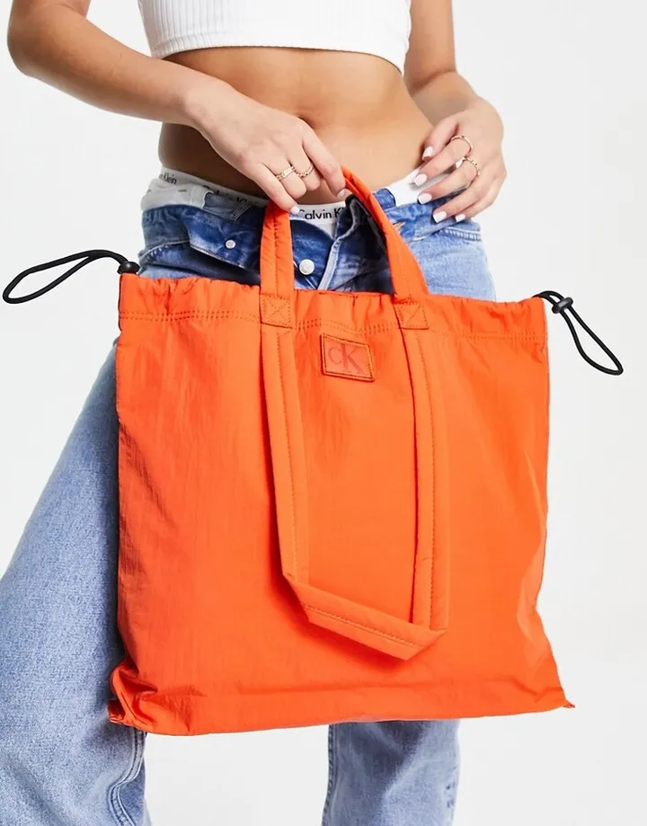 Calvin Klein Jeans city nylon square tote bag in coral orange