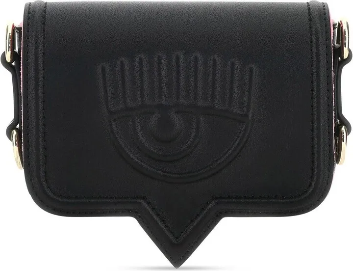 Crossbody bag that can be worn as a belt bag realized in synthetic leather characterized by logo in relief at the front enriched by contrasting rubberized logoed patch at the back.