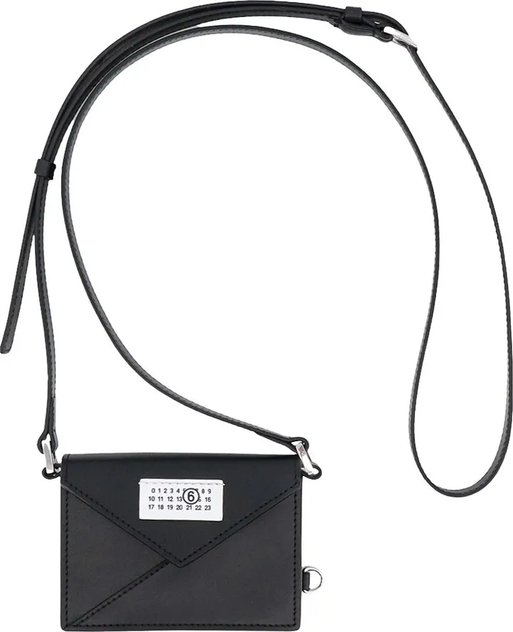 Leather shoulder bag with logo patch on the front