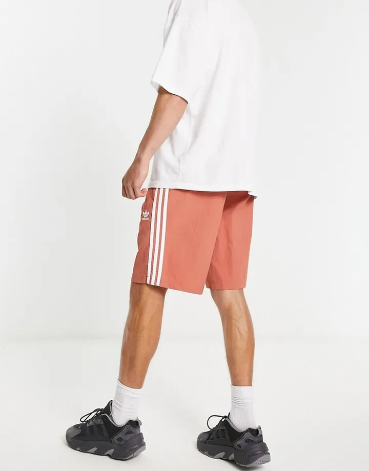 adidas Originals adicolor three stripe 10 inch shorts in beige