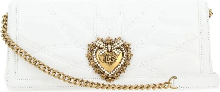 Shoulder bag realized in quilted nappa leather enriched by Cuore Sacro jewel detail on the flap.