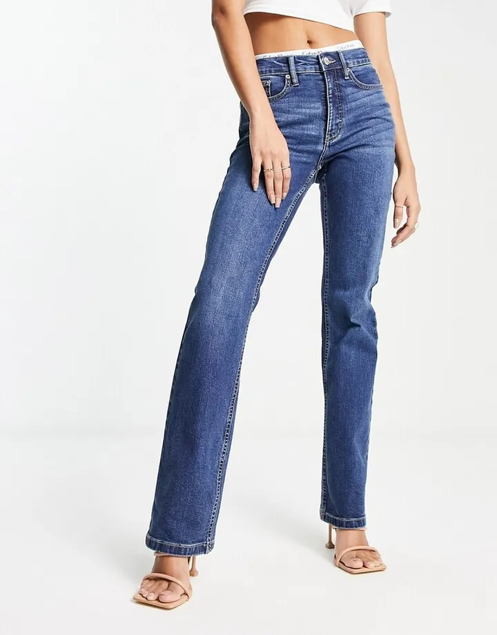 Calvin Klein Jeans high rise bootcut jeans in mid wash