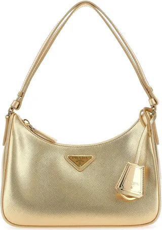 Shoulder bag realized in Saffiano leather enriched by iconic logoed triangle at the front enriched by detachable leather logoed accessory with metal key ring.