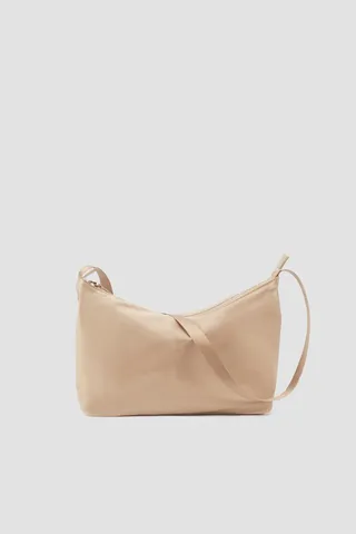 The Deconstructed Sling Bag in beige