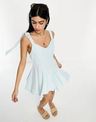 ASOS DESIGN linen tie cross strap swing mini sundress with flares in blue