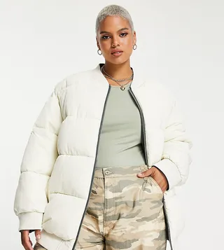 ASOS DESIGN Curve reversible quilted bomber jacket in khaki and cream