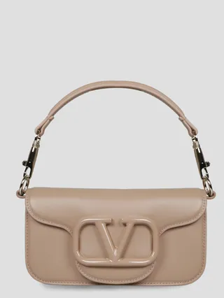Valentino Garavani Locò shoulder bag in calfskin leather with enamel tone-on-tone VLogo Signature detail.