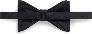 silk Nothing says suave and sophisticated quite like a bow tie. This black silk velvet bow tie from Saint Laurent is all you need to a...
