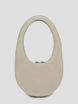 Coperni leather crossbody oval-shaped bag.