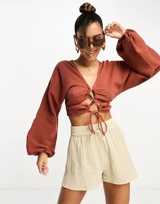ASOS DESIGN long sleeve crinkle top with lace up lattice detail in rust