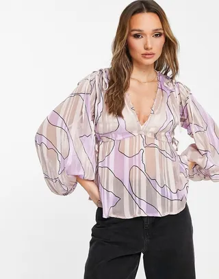 ASOS DESIGN volume long sleeve with tie detail and pelum hem in abstract swirl print