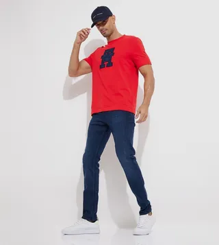 Faded Mid Rise Tapered Fit Jeans