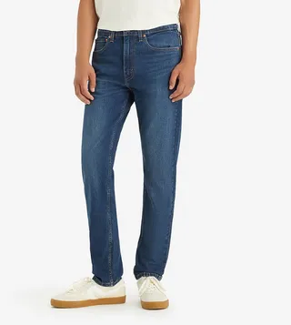 515™ Mid Rise Tapered Jeans