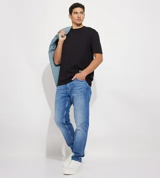 Faded Mid Rise Tapered Fit Jeans