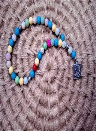 Rosary33 beads of multi colors with a religious silver pendant 